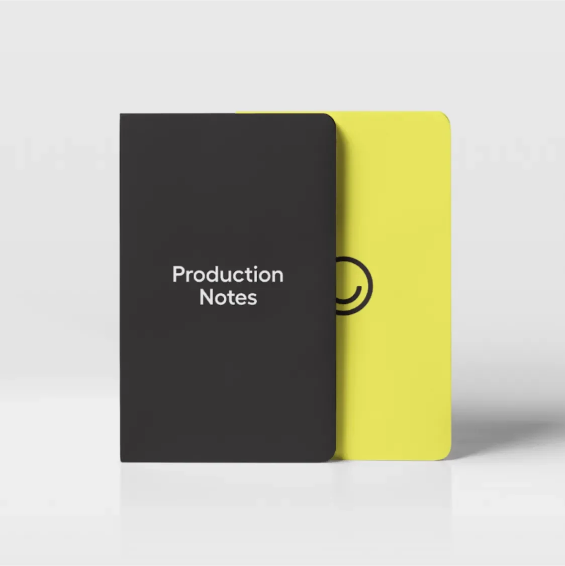 Pocket notebook with "Production Notes" against black on one side and the Hi-Lo smiley against yellow on the other
